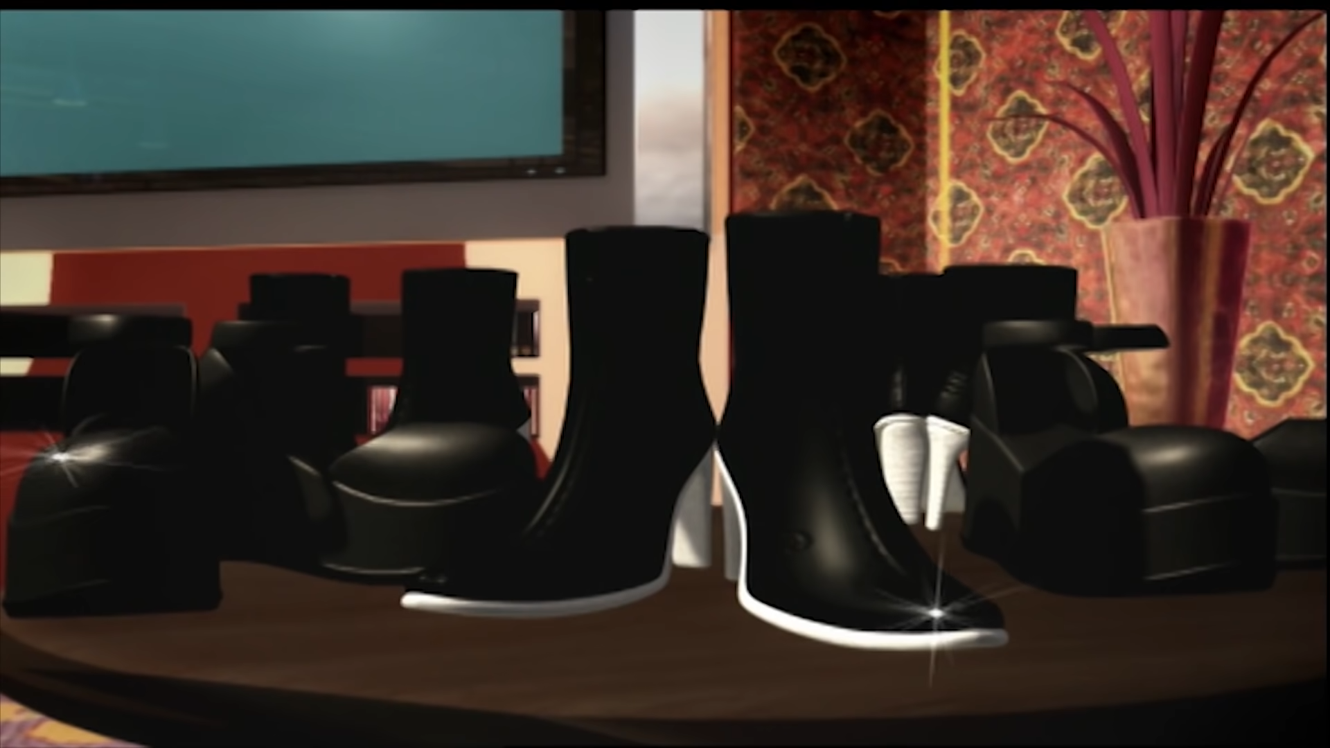 An image of a collection of black ankle boots and platform shoes set on a table.