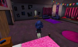 A photograph showing the player in their bedroom (or dreadroom). There's a walk-in closet to the left, a vanity mirror, a bed with pink sheets behind the player, a pink circular rug to their right, a window with a seat at the far right end of the room with the curtains drawn, as well as to purple sofas and a vanity mirror across from the player. The window seat has various plushies and pillows on it, and the walls of the room have various posters showing some Monster High art.