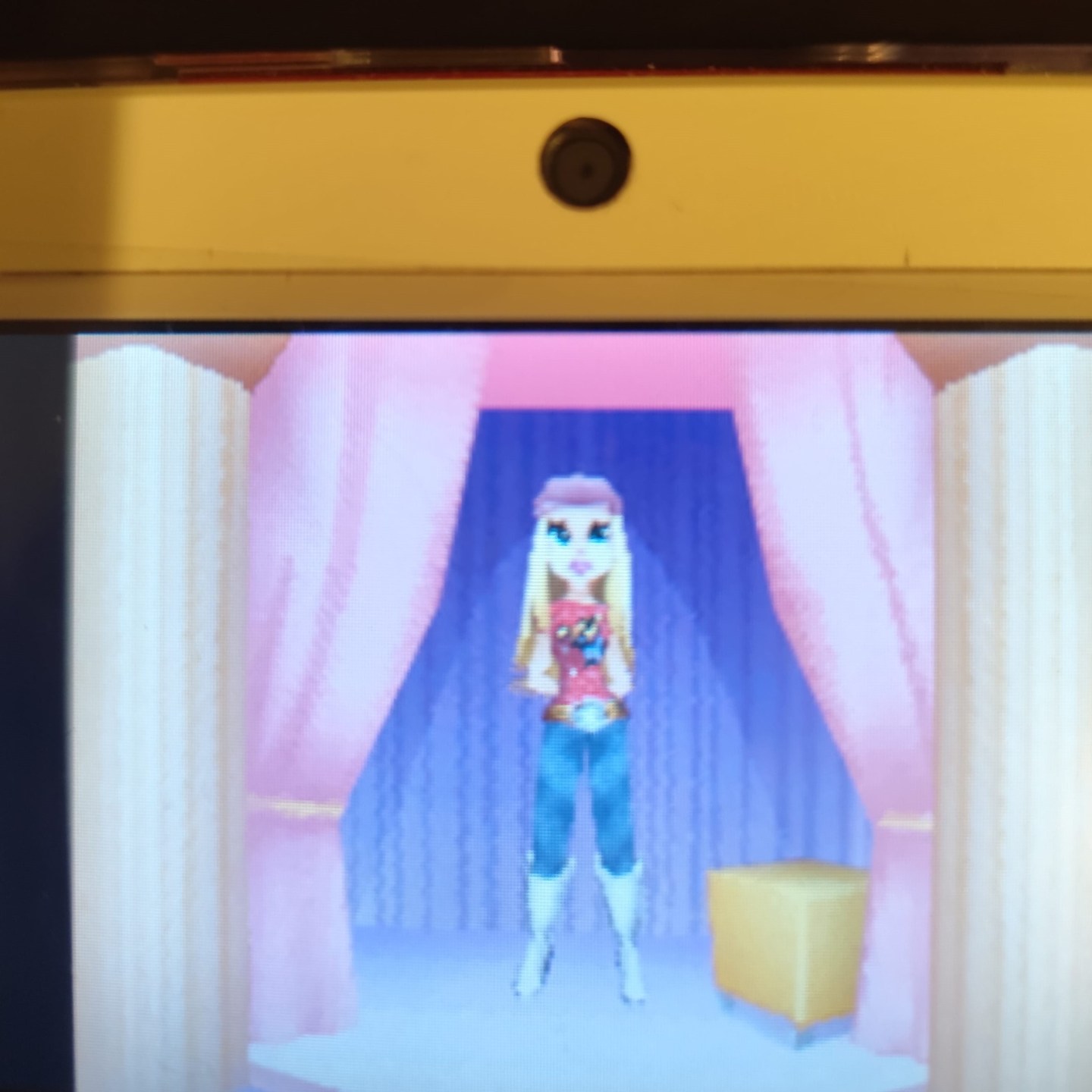 Hannah Montana in 3D. She has almost no discernable facial features and the whole model is very simplified.